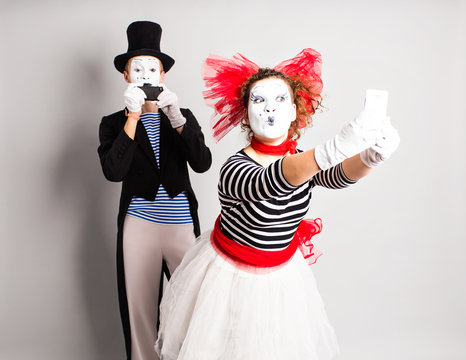 I love selfie. Mime holding camera and making selfie. April Fool's Day concept