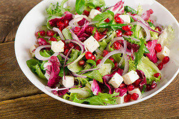 Healthy salad with feta and pomegranate.
