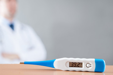 medical thermometer / Medical staff on the grey background and medical thermometer showing the temperature