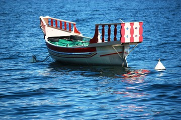 Beautiful old wooden boat in Lake Maggiore, Italy 