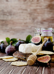 figs with cheese and honey , selective focus