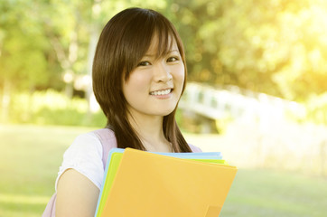 Fototapeta premium Young Asian college girl
