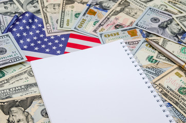 clean sheet of notebook with dollars and US flag