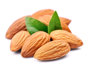 Obraz na płótnie Canvas Almonds nuts with leaves