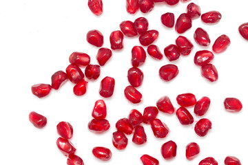 pomegranate seeds on a white background