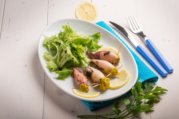 filled squid with salad