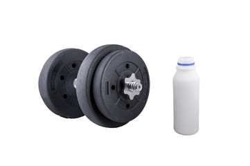 Milk in a glass and Big black dumbells ,over white background