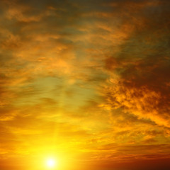 Naklejka na ściany i meble Beautiful bright sunset. Heavenly background.