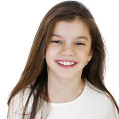Portrait of a charming little girl smiling at camera