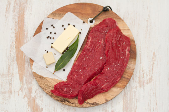 raw beef with butter, herbs and black pepper