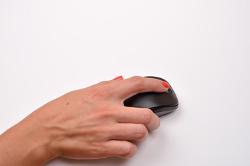 Close-up of a women hand using modern computer mouse on white su
