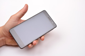 Male hand holding blank mobile smartphone with clipping path for