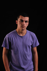 Portrait of young man wearing t-shirt looking at camera