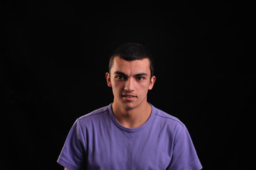 Portrait of young man wearing t-shirt looking at camera