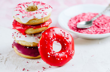 Homemade colorful donuts with icing glaze