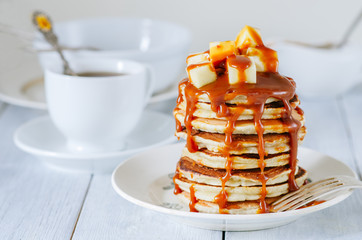 Light breakfast with pancake, apples and caramel