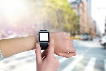 Composite image of woman using smartwatch
