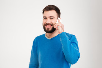 Smiling man talking on the phone