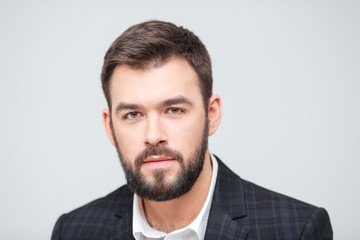 Serious businessman looking at camera