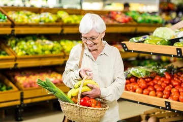 Senior woman holding wicker basket