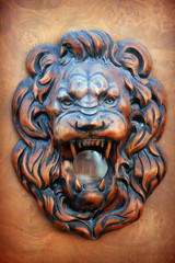 Wooden relief of lion