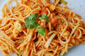 stir-fried spaghetti with egg and ketchup on dish
