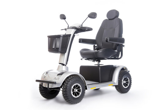 Fototapeta generic mobility scooter for disabled or elderly people against