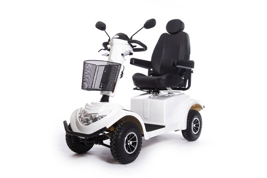 Fototapeta generic mobility scooter for disabled or elderly people against