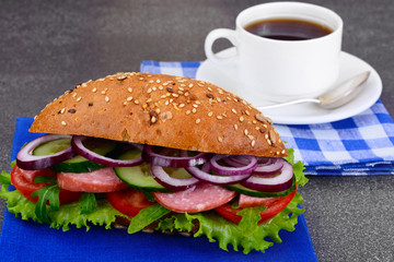 Healthy eating: Fresh sandwich with lettuce, tomato and onion.