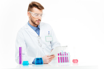 Chemist using tablet computer