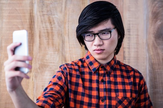 Cinfident hipster taking a selfie