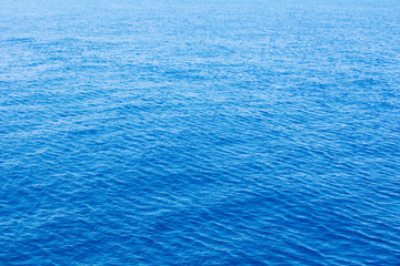 Blue sea surface with waves