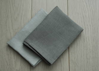 grey towels pile isolated on wooden background