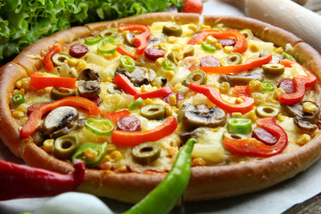 Delicious sliced pizza with vegetables, close-up