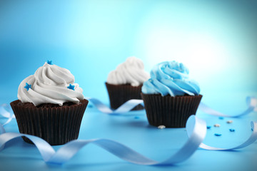 Chocolate cupcakes on blue background