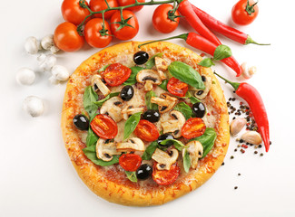 Delicious tasty pizza with vegetables on light background