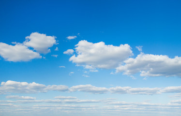 white fluffy clouds in the blue sky