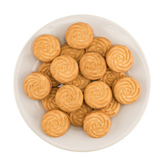 Obraz na płótnie Canvas Tasty cookies in white plate on a white background