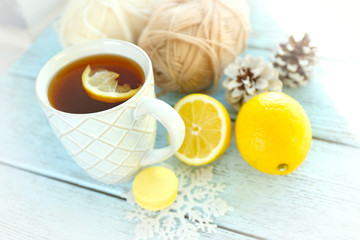 Beautiful winter composition with cup of hot drink, on wooden table