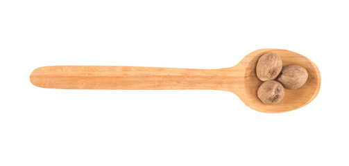 Nutmeg in wooden spoon