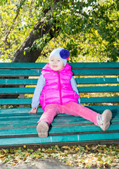 Adorable little child girl at fall. Use it for baby, parenting or love concept