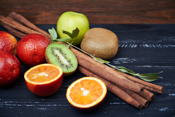 Fresh oranges with cinnamon sticks