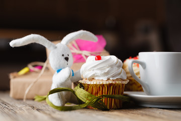 cupcake and rabbit toy with cup of coffee