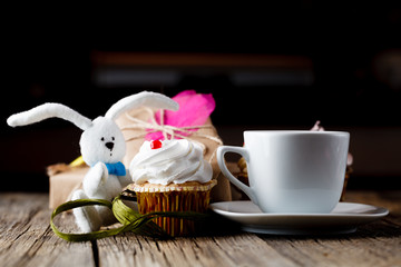 cupcake and rabbit toy with cup of coffee