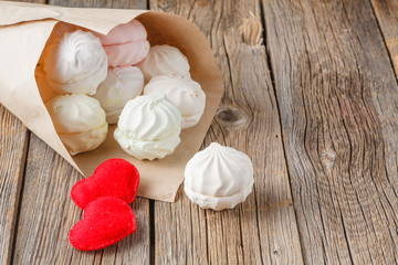 Love message concept, sweets and heart on rustic table
