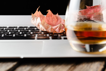 glass with whiskey on wooden table