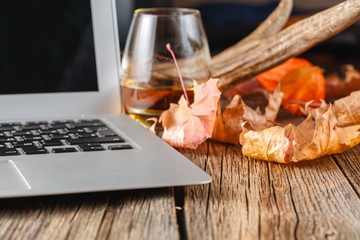 glass with whiskey on wooden table