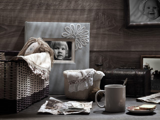 Mug with a drink, old photos, glasses, crafts. Vintage, retro. Concept - memory, memories. Old children's photos 