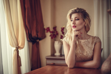 fashion outdoor photo of elegant beautiful woman with blond hair