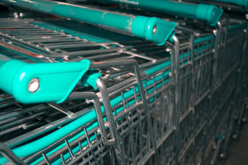 Close up green shopping cart stacked abstract